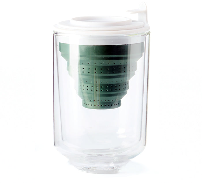 The Eclipse cup with Tuffy Steeper, featuring a double-walled glass cup with a collapsible green silicone tea infuser with a white lid inside the cup