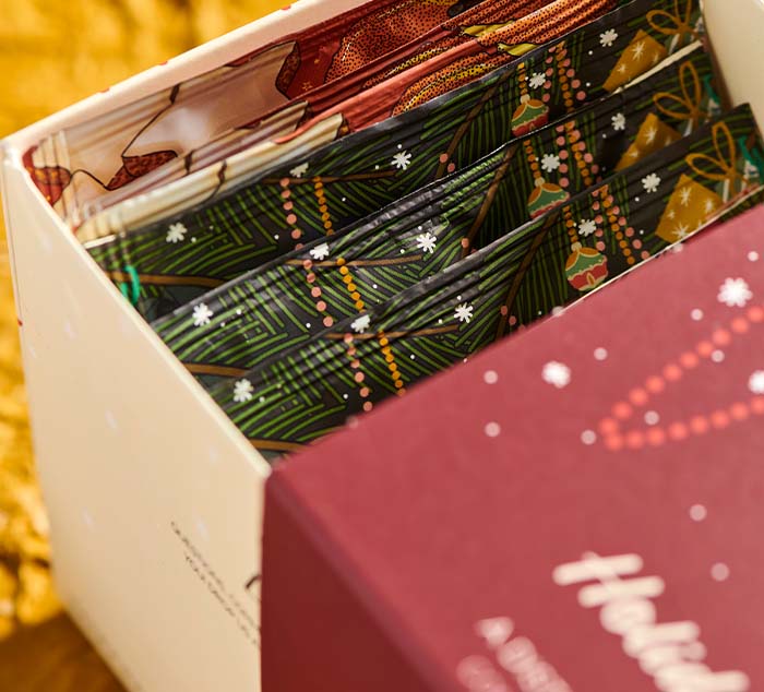 
                  
                    a close up shot of a box with wrapped tea bags inside
                  
                