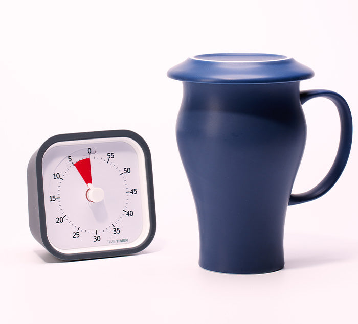 
                  
                    a timer indicating five minutes sits next to a tea mug steeping
                  
                